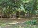 Wooden bridge through trees with ravine in the backyard at 16134 Tinura Ct # 134, Tega Cay, SC 29708