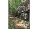 Landscaped backyard with tiered stone stairs and garden lights at 16134 Tinura Ct # 134, Tega Cay, SC 29708