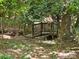 Backyard wooden walking bridge surrounded by trees and greenery at 16134 Tinura Ct # 134, Tega Cay, SC 29708