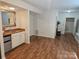 A view of the basement featuring a wet bar, storage, and access to the home's entrance at 16134 Tinura Ct # 134, Tega Cay, SC 29708