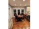 Dining area with a round table, hardwood floors, and natural light from windows at 16134 Tinura Ct # 134, Tega Cay, SC 29708