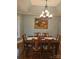 Dining area with bay window and hardwood floor; pendant lighting and framed artwork at 16134 Tinura Ct # 134, Tega Cay, SC 29708