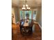 Cozy dining room featuring a dark wood table set and bay windows at 16134 Tinura Ct # 134, Tega Cay, SC 29708