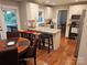 This is a kitchen with granite countertops, white cabinets, and a breakfast bar at 16134 Tinura Ct # 134, Tega Cay, SC 29708