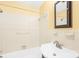 Cozy bathroom with tiled shower-tub combination, vanity sink and dark framed mirror at 1811 Belmar Dr, Gastonia, NC 28052