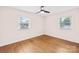 Inviting bedroom with hardwood floors and two bright windows at 1811 Belmar Dr, Gastonia, NC 28052