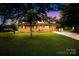 Charming brick home with a well-manicured lawn and mature trees creating a picturesque setting at 1811 Belmar Dr, Gastonia, NC 28052