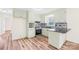Well-lit kitchen with updated appliances, stylish backsplash, and durable hard wood flooring at 1811 Belmar Dr, Gastonia, NC 28052