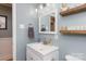 Charming bathroom with neutral color palette, vanity, decorative shelves, and coordinated fixtures at 192 Bailey Ave, Rock Hill, SC 29732