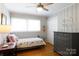 Cozy bedroom with wood floors, ceiling fan, neutral tones, a decorative dresser and a window for natural light at 192 Bailey Ave, Rock Hill, SC 29732