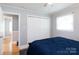 Bedroom featuring hardwood floors, neutral tones, window, and a double door closet providing a tranquil and well-lit space at 192 Bailey Ave, Rock Hill, SC 29732
