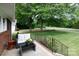 Cozy front porch with outdoor seating area overlooking a sprawling, well-manicured lawn at 192 Bailey Ave, Rock Hill, SC 29732
