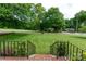 Brick steps lead to a well-manicured lawn with mature trees, offering picturesque curb appeal at 192 Bailey Ave, Rock Hill, SC 29732