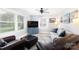 Cozy living room with neutral walls, hardwood floors, and ample natural light from large windows at 192 Bailey Ave, Rock Hill, SC 29732