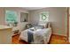 A beautifully decorated bedroom with hardwood floors and bright natural light at 211 Amos Homesley Rd, Cherryville, NC 28021