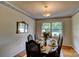 Cozy dining room featuring a wood table set for six, with a window view at 211 Amos Homesley Rd, Cherryville, NC 28021