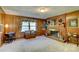 Warm living room with wood paneling, a brick fireplace, and cozy decor at 211 Amos Homesley Rd, Cherryville, NC 28021