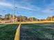 A well-maintained baseball field surrounded by fencing offering an active recreation space for residents and visitors at 2125 Belle Vernon Ave, Charlotte, NC 28210