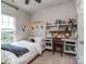 Bright bedroom with decor, desk, and a window that enhances the room's open feel at 2125 Belle Vernon Ave, Charlotte, NC 28210