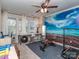 Versatile bedroom with exercise equipment, large windows and a unique accent wall at 2125 Belle Vernon Ave, Charlotte, NC 28210