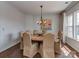 Elegant dining room features a round table, upholstered chairs, and decorative chandelier at 2125 Belle Vernon Ave, Charlotte, NC 28210