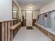 Mudroom with wood-paneled walls, built-in storage cubbies and an exterior door at 2125 Belle Vernon Ave, Charlotte, NC 28210