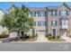 Charming townhome with well-maintained landscaping, a garage, and a welcoming entryway at 2125 Belle Vernon Ave, Charlotte, NC 28210