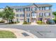 Attractive townhouse exterior with brick facade, blue shutters, and attached garage at 2125 Belle Vernon Ave, Charlotte, NC 28210