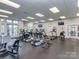 Community gym featuring cardio equipment, weights, and mounted TVs at 2125 Belle Vernon Ave, Charlotte, NC 28210