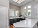 Stylish kitchenette with modern cabinets, quartz countertops, and ample natural light at 2125 Belle Vernon Ave, Charlotte, NC 28210