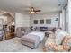 Spacious living room features plush sectional sofa, area rug, ceiling fan, and decorative wall art at 2125 Belle Vernon Ave, Charlotte, NC 28210