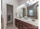 This spacious main bathroom features a double vanity, large mirror, and a separate shower and tub at 2125 Belle Vernon Ave, Charlotte, NC 28210