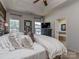 Relax in this spacious main bedroom with large windows, a tray ceiling, and an ensuite bathroom at 2125 Belle Vernon Ave, Charlotte, NC 28210