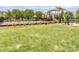 Community playground with swings, play structures, and picnic tables in a fenced area at 2125 Belle Vernon Ave, Charlotte, NC 28210