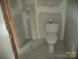 Bathroom with a new toilet and tile floor at 216 N Rowan Ave, Spencer, NC 28159
