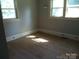 Bedroom with hard wood floors and natural light at 216 N Rowan Ave, Spencer, NC 28159