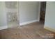 Bedroom with hard wood floors and a closet and bathroom at 216 N Rowan Ave, Spencer, NC 28159