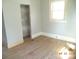 Bedroom with hard wood floors and a closet at 216 N Rowan Ave, Spencer, NC 28159