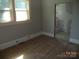 Bedroom with hard wood floors and natural light and view of bathroom at 216 N Rowan Ave, Spencer, NC 28159