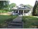 Charming home with a welcoming front porch and well-maintained yard at 216 N Rowan Ave, Spencer, NC 28159