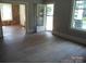 Inviting living room with charming doorway and natural light, presenting a blank canvas for renovation and design at 216 N Rowan Ave, Spencer, NC 28159