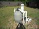 Pool equipment sitting in the yard needs maintenance, offering potential for future aquatic enjoyment at 216 N Rowan Ave, Spencer, NC 28159