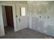 Room in need of work with doorway, unfinished walls, and a vintage door with glass at 216 N Rowan Ave, Spencer, NC 28159