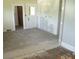 Partially renovated room with a doorway, showcasing a blank canvas ready for transformation at 216 N Rowan Ave, Spencer, NC 28159