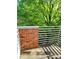 Outdoor balcony with brick railing and peaceful, green surroundings at 226 Magnolia Ave, Charlotte, NC 28203