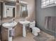 Bathroom with double sinks, tiled walls, and modern fixtures offering a functional space at 226 Magnolia Ave, Charlotte, NC 28203