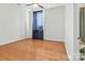 Bedroom features hardwood floors, a window with a dark curtain, and a ceiling fan at 226 Magnolia Ave, Charlotte, NC 28203