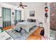 Bright bedroom features a ceiling fan, a cozy rug, and lots of natural light from the patio door at 226 Magnolia Ave, Charlotte, NC 28203