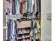 Organized walk-in closet with shelving and hanging space, optimizing storage and accessibility at 226 Magnolia Ave, Charlotte, NC 28203