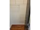 This closet features wooden floors, white walls, and white shelving along the top and halfway down the wall at 226 Magnolia Ave, Charlotte, NC 28203